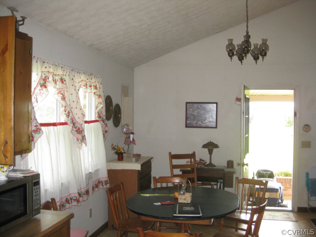 1067 Unity Road Kenbridge, VA 23944 - Photo 15 of 21 a view of a dining room with furniture window and outside view