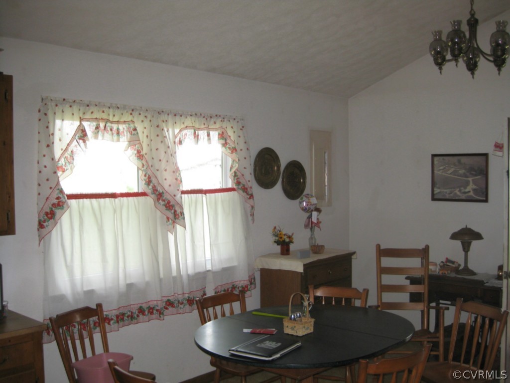 1067 Unity Road Kenbridge, VA 23944 - Photo 16 of 21 a dining room with furniture and a window