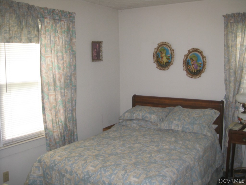1067 Unity Road Kenbridge, VA 23944 - Photo 18 of 21 a bedroom with a bed and a window