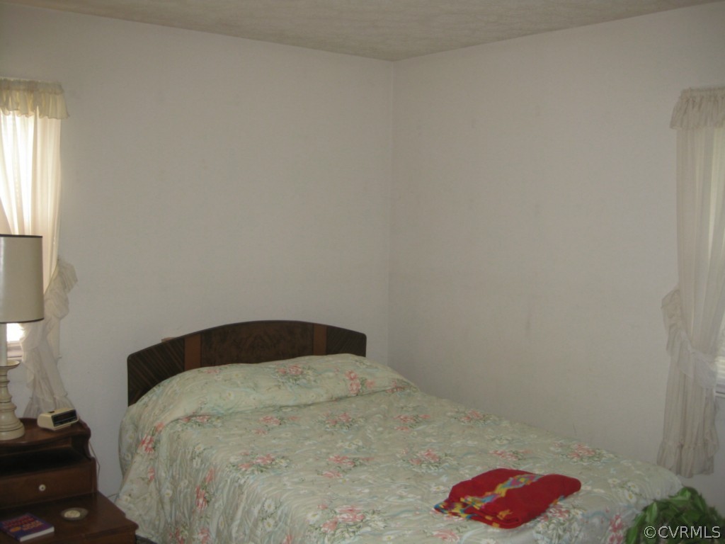 1067 Unity Road Kenbridge, VA 23944 - Photo 19 of 21 a bedroom with a bed and a dresser