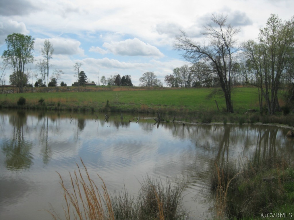 1067 Unity Road Kenbridge, VA 23944 - Photo 9 of 21 a view of a lake with houses in the back