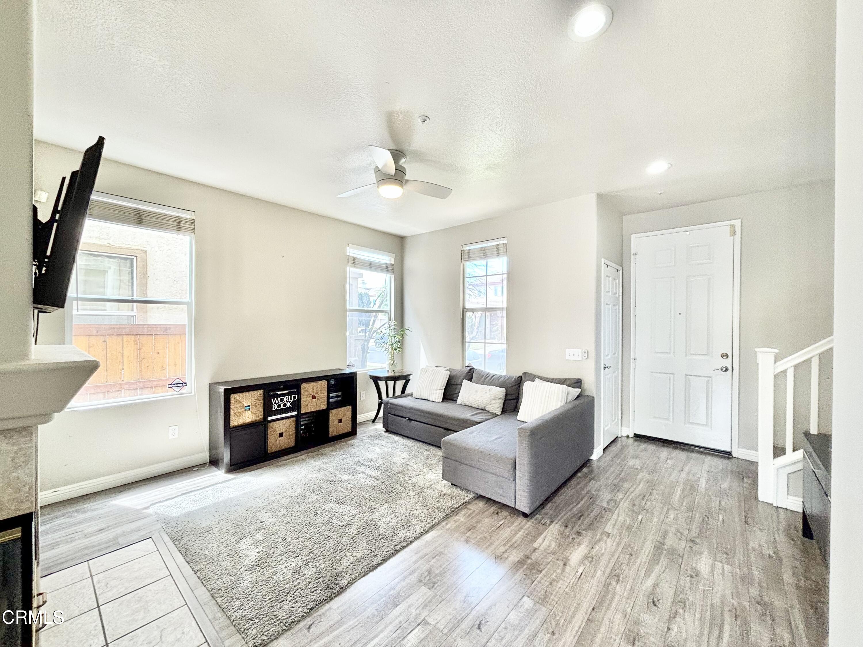 818 Navigator Way Oxnard, CA 93035 - Photo 3 of 29 a living room with furniture and a flat screen tv