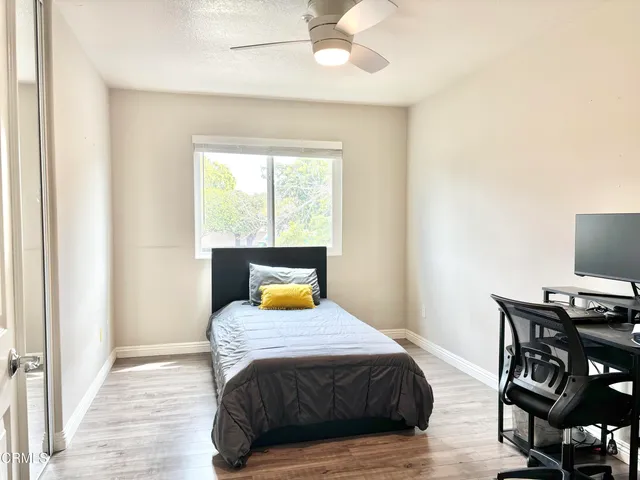 a bedroom with a bed and a table