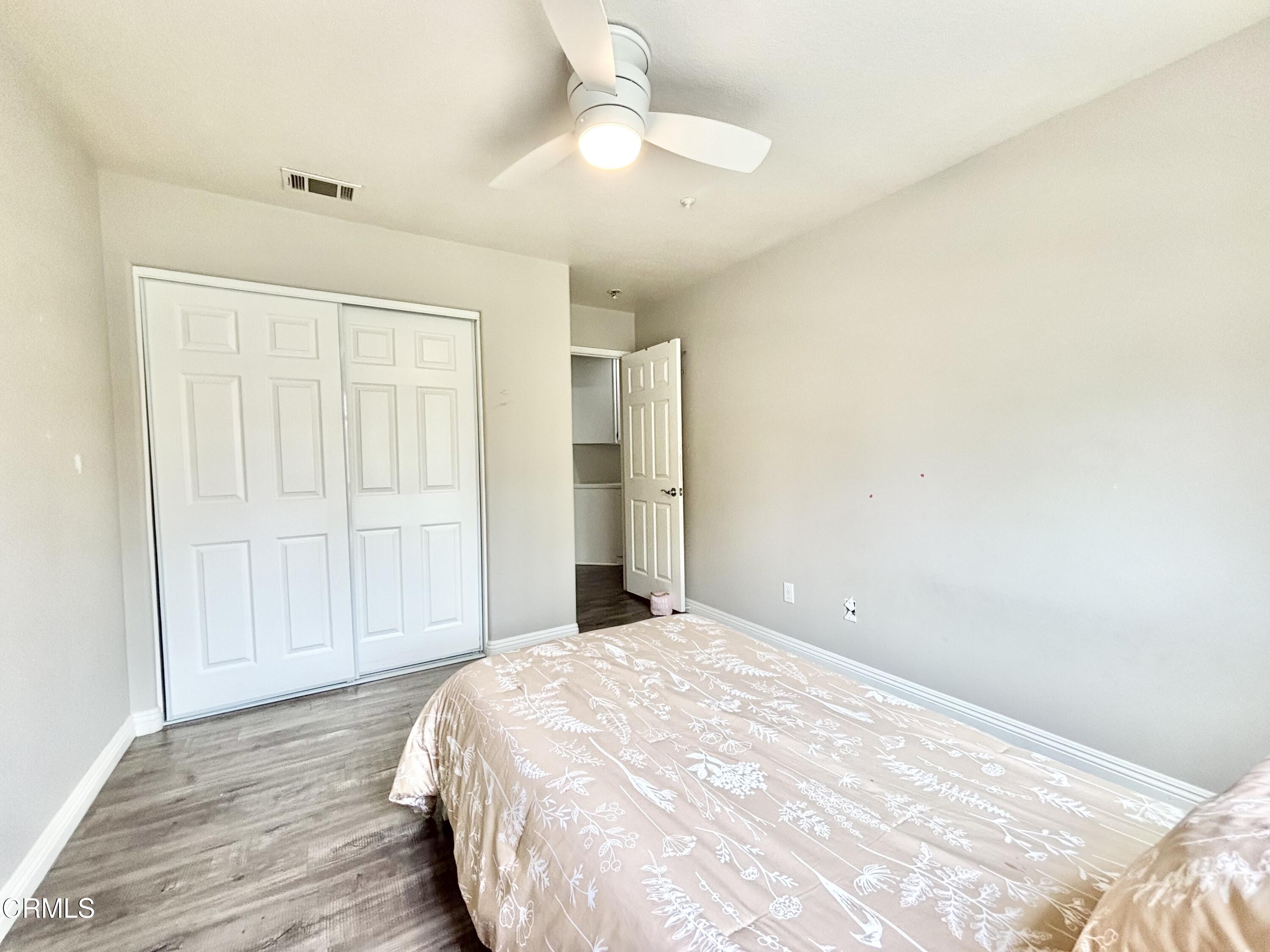 818 Navigator Way Oxnard, CA 93035 - Photo 9 of 29 a view of a livingroom with wooden floor and closet