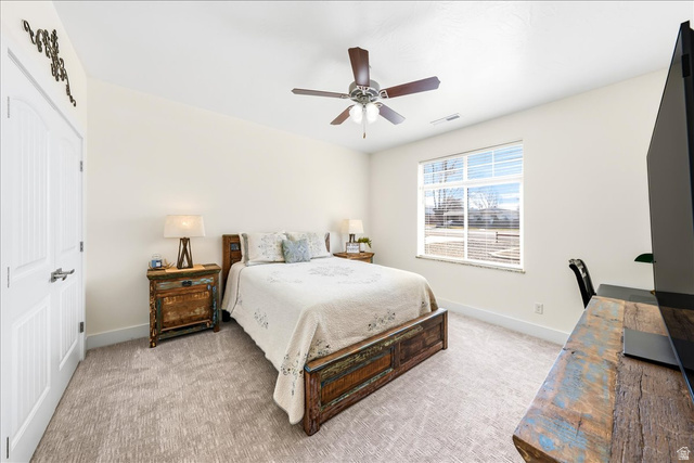 357 East Main Street Enterprise, UT 84725 - Photo 36 of 71 Bedroom featuring light colored carpet, ceiling fan, and a closet