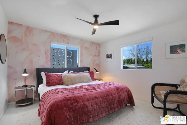 a bedroom with a bed and window