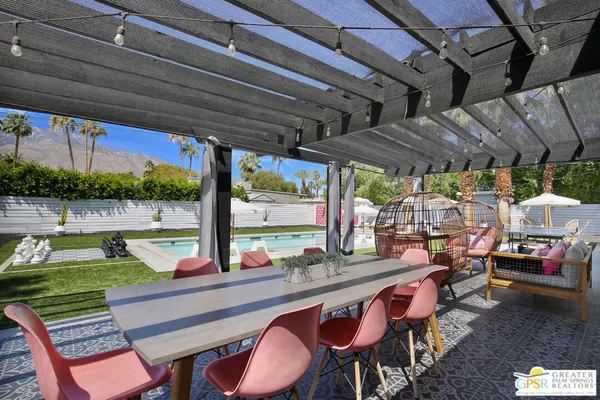 a view of a patio with chairs and a table and chairs
