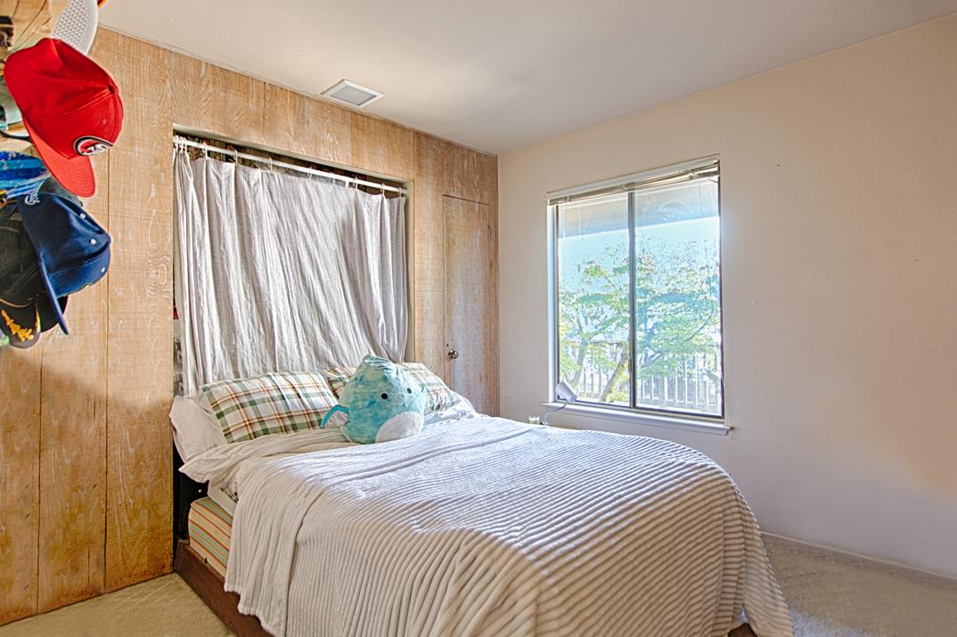 369 Sea Ridge Road Aptos, CA 95003 - Photo 15 of 20 a bedroom with a bed and a window