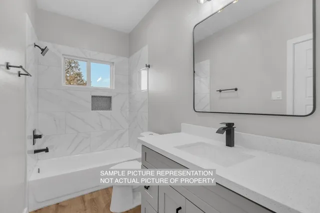 a bathroom with a sink and a bathtub