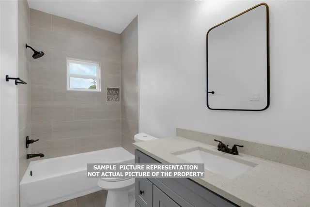 a bathroom with a sink a toilet and mirror