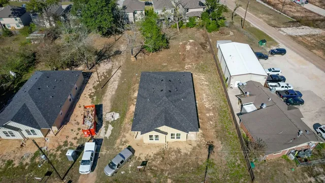 an aerial view of houses with outdoor space
