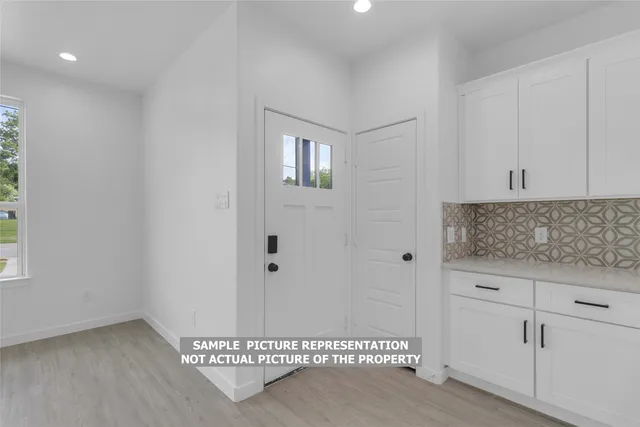 a view of a hallway with entryway