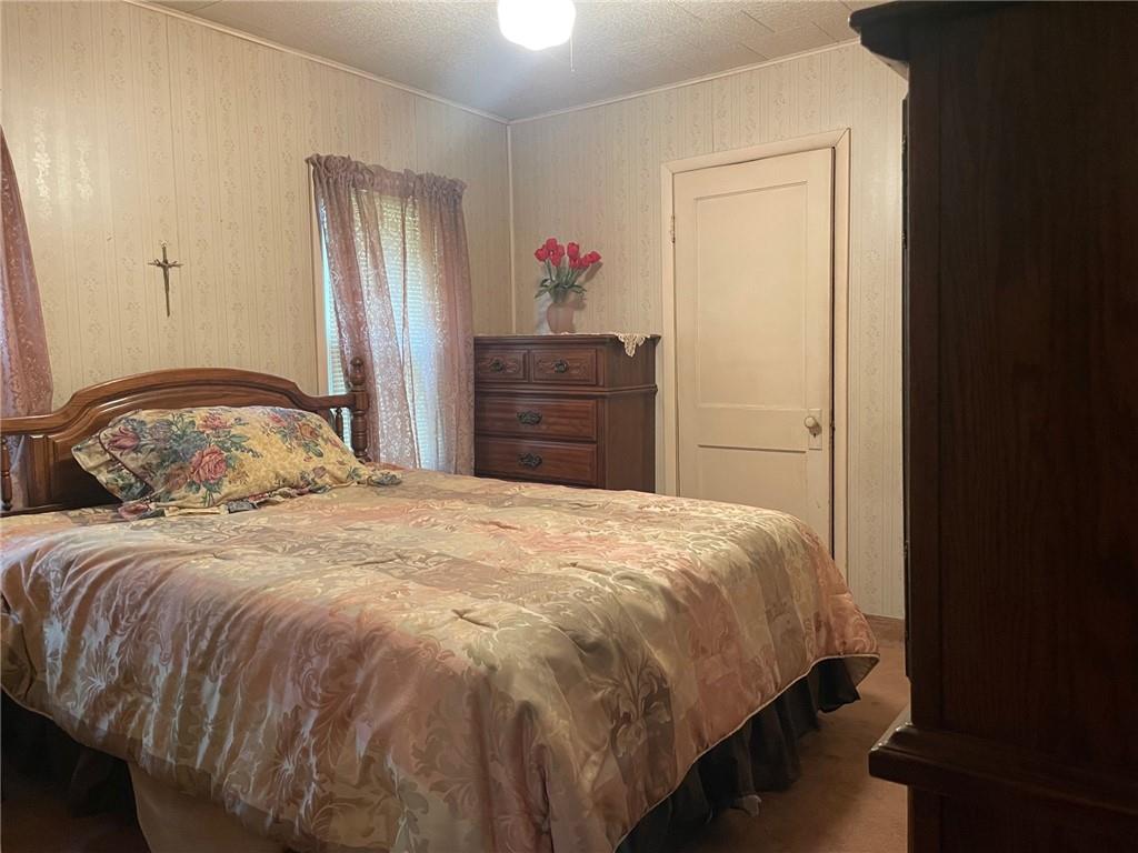 1606 Atkinson Street New Castle, PA 16101 - Photo 13 of 15 a bedroom with a bed and a closet