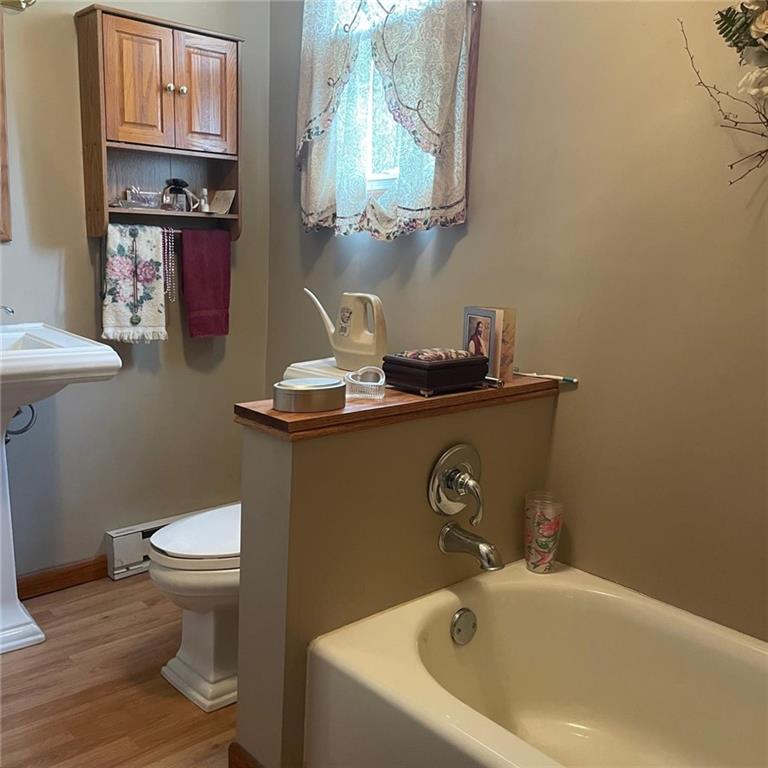 1606 Atkinson Street New Castle, PA 16101 - Photo 14 of 15 a bathroom with a sink a toilet and mirror