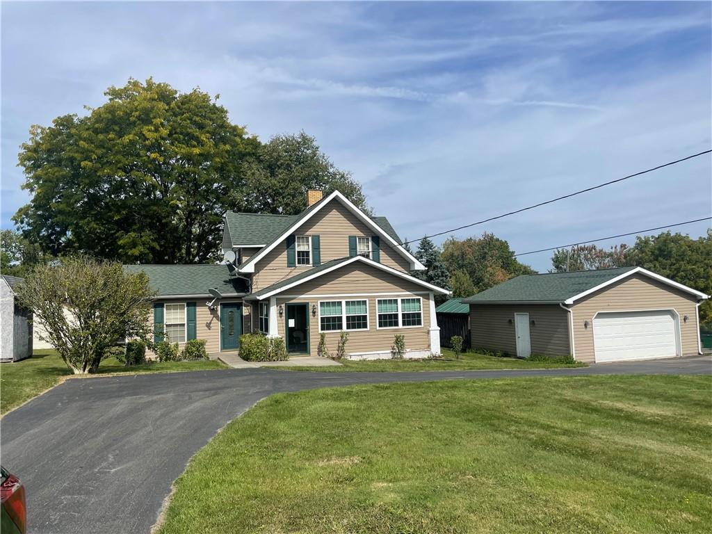 1606 Atkinson Street New Castle, PA 16101 - Photo 2 of 15 a front view of a house with a garden and yard