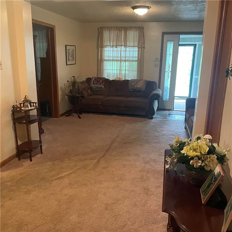 1606 Atkinson Street New Castle, PA 16101 - Photo 10 of 15 a living room with couches dresser and a large window