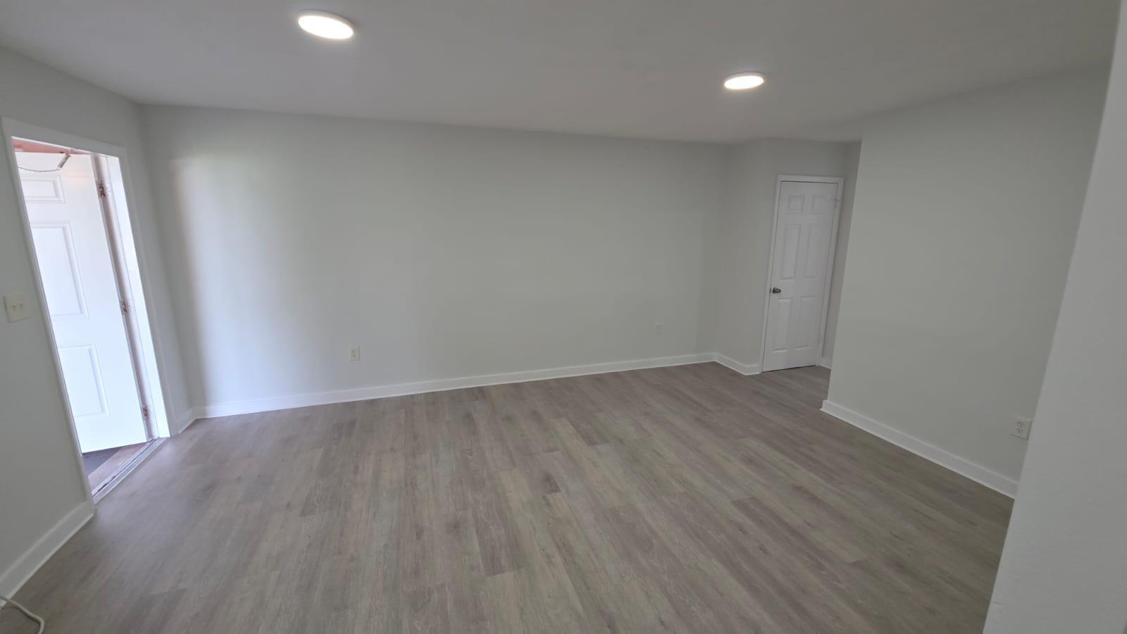 7624 Pembroke Road, Unit C Miramar, FL 33023 - Photo 12 of 13 wooden floor in an empty room with a window