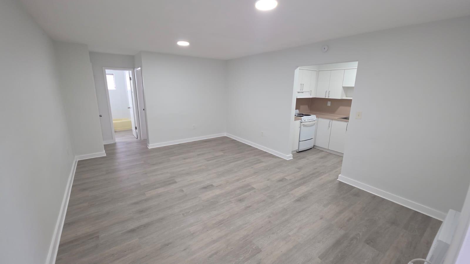 7624 Pembroke Road, Unit C Miramar, FL 33023 - Photo 7 of 13 wooden floor in an empty room with a window