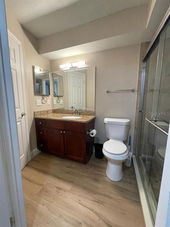 5148 Conroy Road, Unit 18 Orlando, FL 32811 - Photo 14 of 30 a spacious bathroom with a toilet sink and mirror