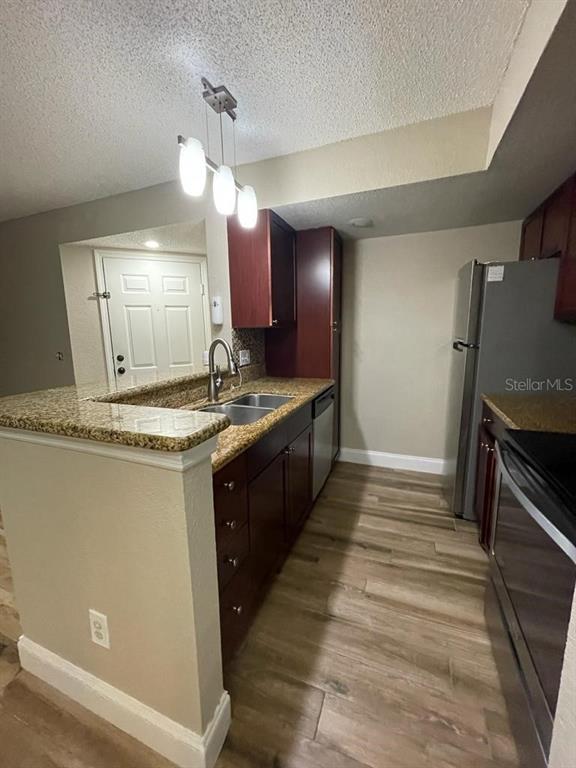5148 Conroy Road, Unit 18 Orlando, FL 32811 - Photo 19 of 30 a bathroom with a sink and a mirror