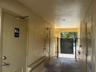 5148 Conroy Road, Unit 18 Orlando, FL 32811 - Photo 23 of 30 a view of a bathroom with a shower and a sink