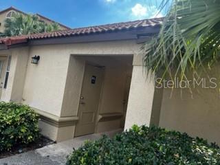 5148 Conroy Road, Unit 18 Orlando, FL 32811 - Photo 24 of 30 a couple of potted plants in front of door