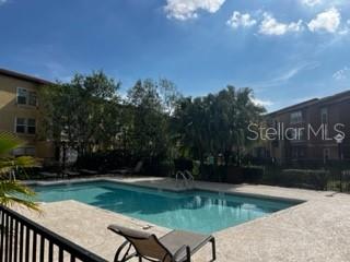 5148 Conroy Road, Unit 18 Orlando, FL 32811 - Photo 25 of 30 a view of a swimming pool with a yard