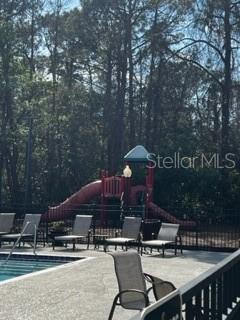 5148 Conroy Road, Unit 18 Orlando, FL 32811 - Photo 28 of 30 a view of a chairs and table in the patio