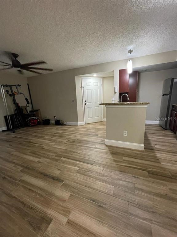 5148 Conroy Road, Unit 18 Orlando, FL 32811 - Photo 9 of 30 a view of a room with wooden floor and a window