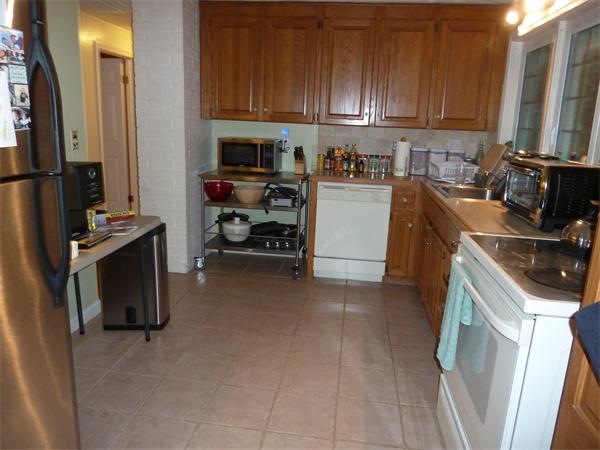 9 Gary Road Chelmsford, MA 01824 - Photo 3 of 14 a view of a kitchen with fridge and wooden floor