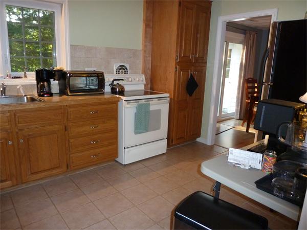 9 Gary Road Chelmsford, MA 01824 - Photo 4 of 14 a kitchen with appliances a sink and cabinets
