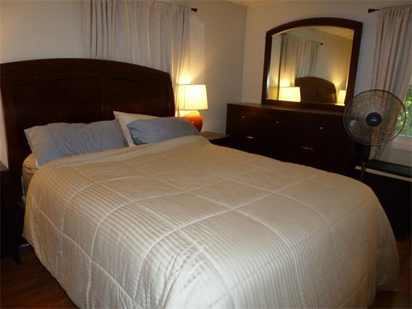 9 Gary Road Chelmsford, MA 01824 - Photo 8 of 14 a bedroom with bed mirror and window