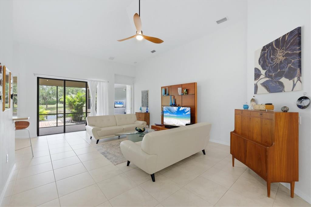 428 Snapdragon Loop Bradenton, FL 34212 - Photo 7 of 33 a living room with furniture and a flat screen tv