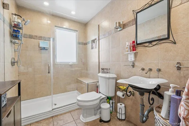 a bedroom with a bed and a wooden floor