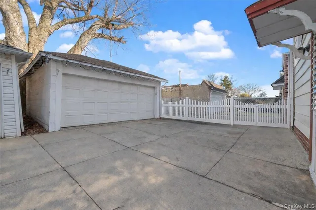 a view of a white house with many windows