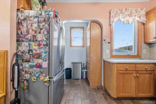 a kitchen with stainless steel appliances granite countertop a sink stove and microwave