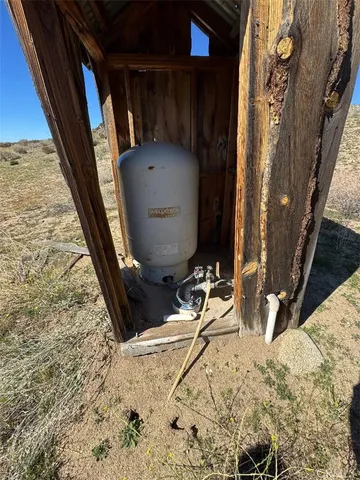 a view of a wooden house with a yard