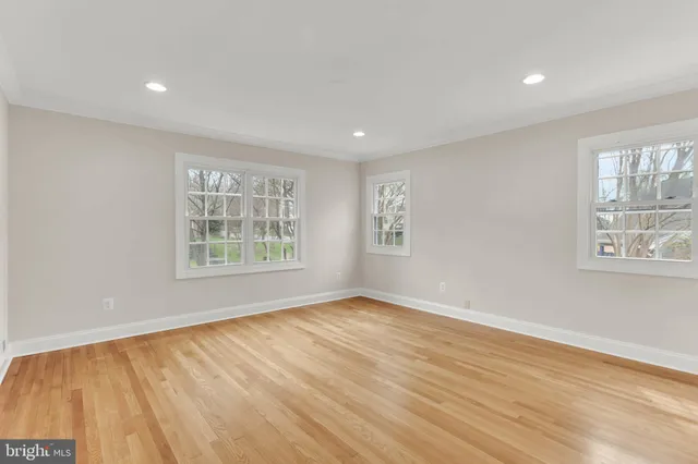 a bathroom with a sink a toilet and a window