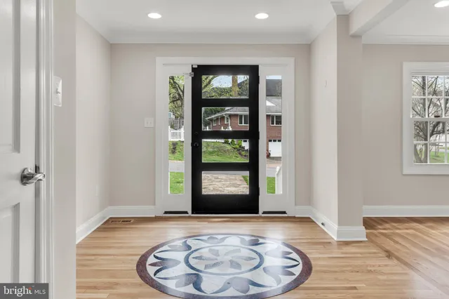 a view of kitchen with granite countertop stainless steel appliances refrigerator sink and cabinets