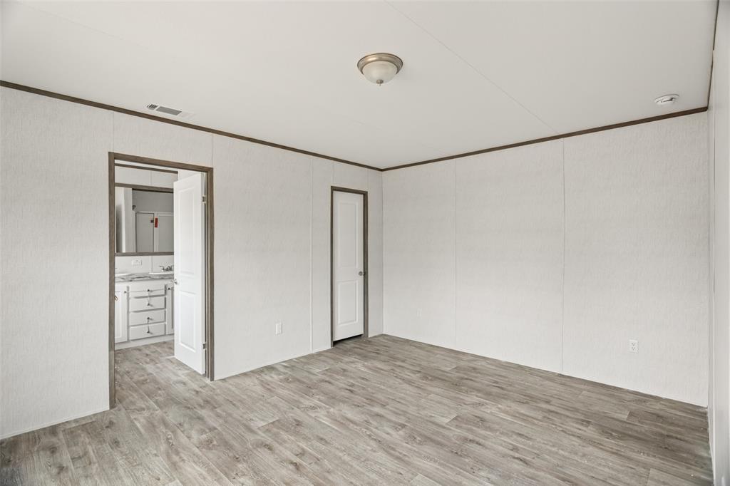 3606 Hilltop Road Granbury, TX 76048 - Photo 15 of 25 a view of a room with wooden floor