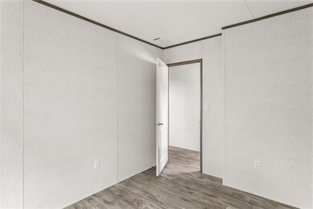 3606 Hilltop Road Granbury, TX 76048 - Photo 21 of 25 a view of a room with wooden floor