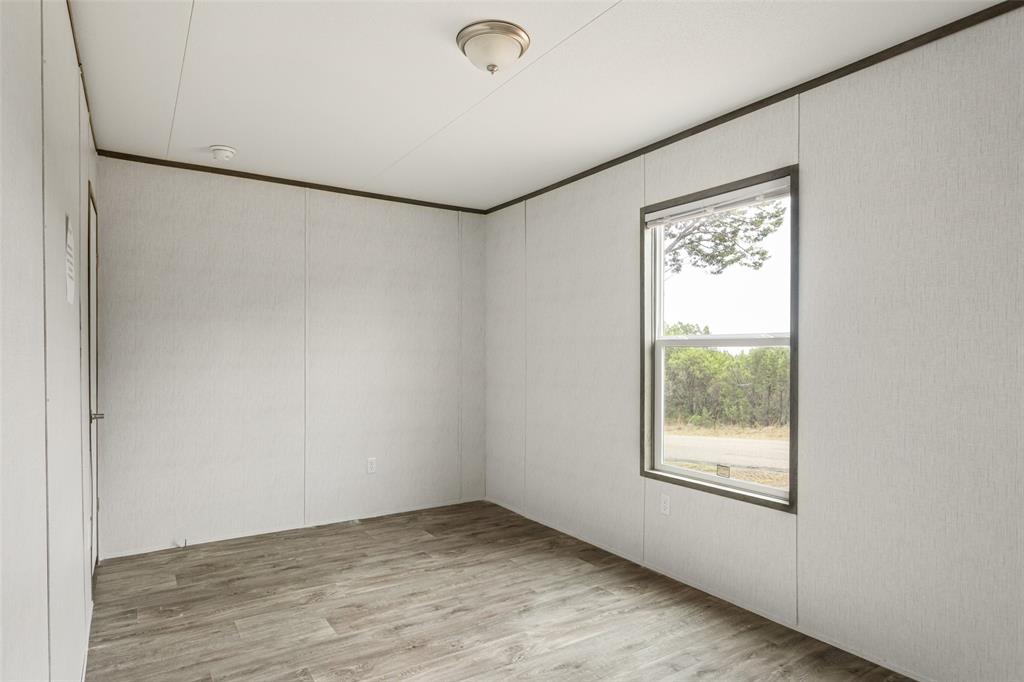 3606 Hilltop Road Granbury, TX 76048 - Photo 23 of 25 an empty room with a window