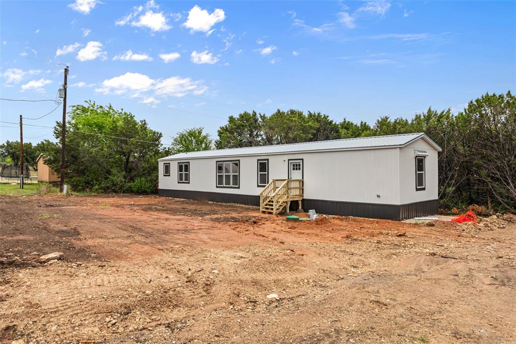 3606 Hilltop Road Granbury, TX 76048 - Photo 3 of 25 a view of a house with a yard