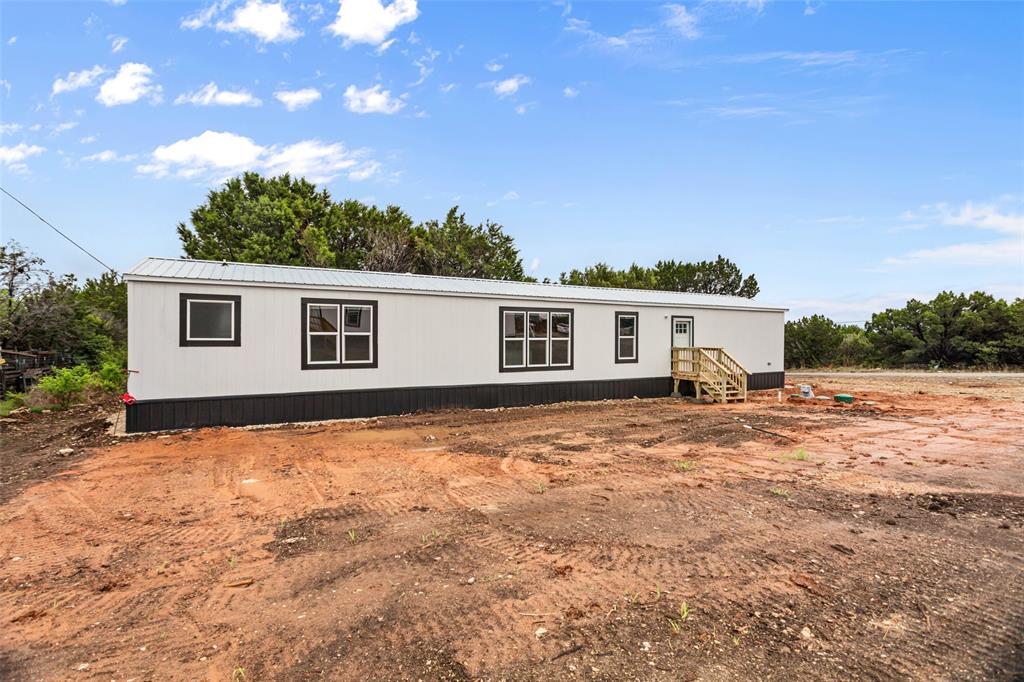 3606 Hilltop Road Granbury, TX 76048 - Photo 5 of 25 a view of a yard with a house
