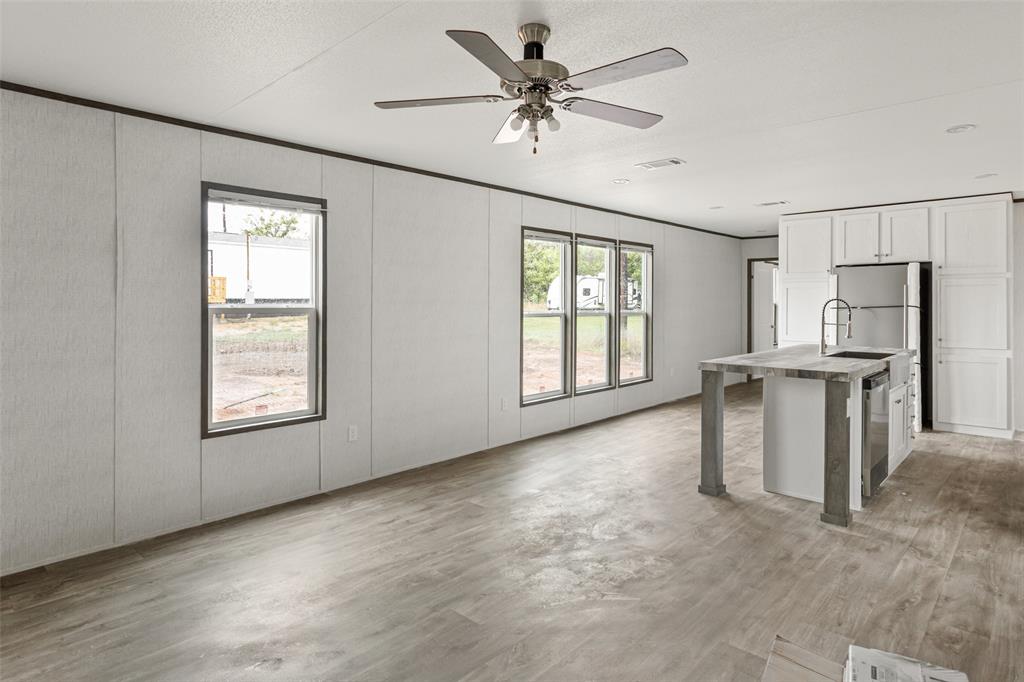 3606 Hilltop Road Granbury, TX 76048 - Photo 8 of 25 a view of an empty room with a window