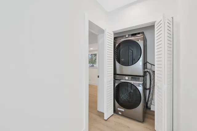 a view of a hallway with washer and dryer