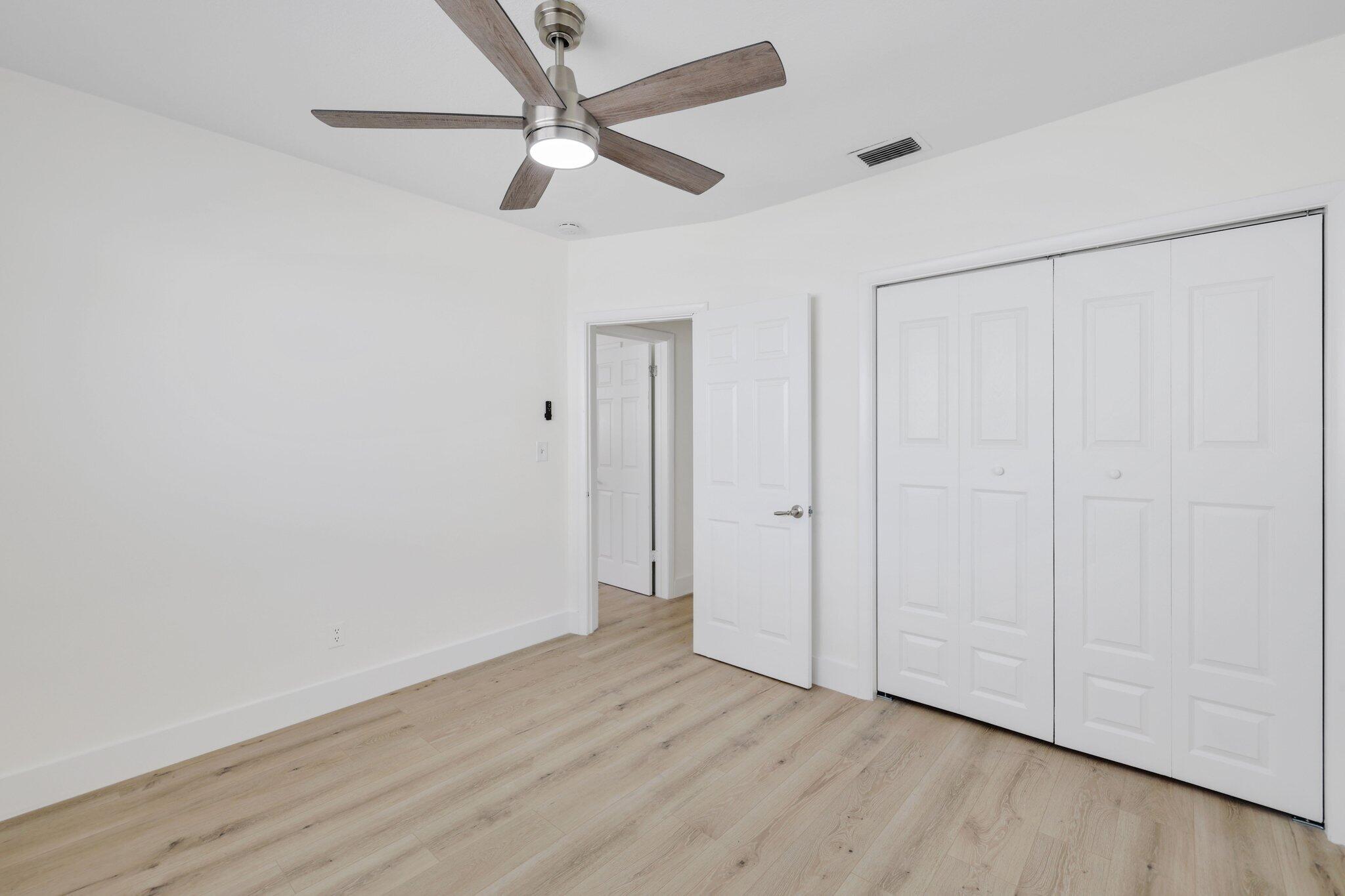1198 Southwest 3rd Street Boca Raton, FL 33486 - Photo 19 of 29 a view of an empty room with wooden floor