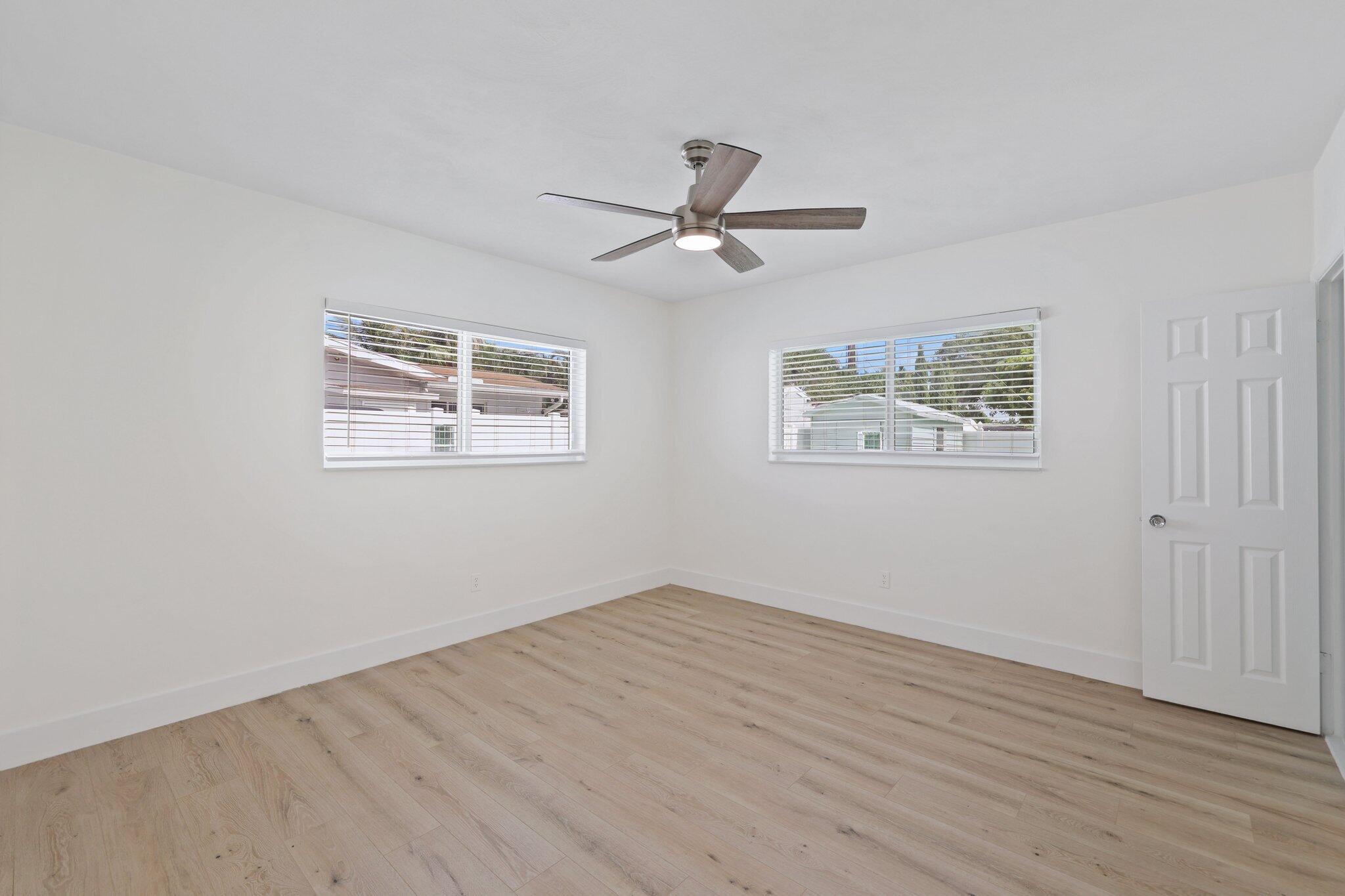 1198 Southwest 3rd Street Boca Raton, FL 33486 - Photo 20 of 29 a view of empty room with wooden floor and window