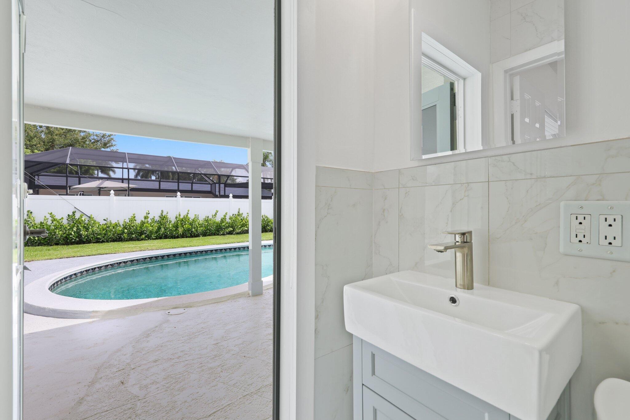 1198 Southwest 3rd Street Boca Raton, FL 33486 - Photo 23 of 29 a view of bathroom sink and mirror