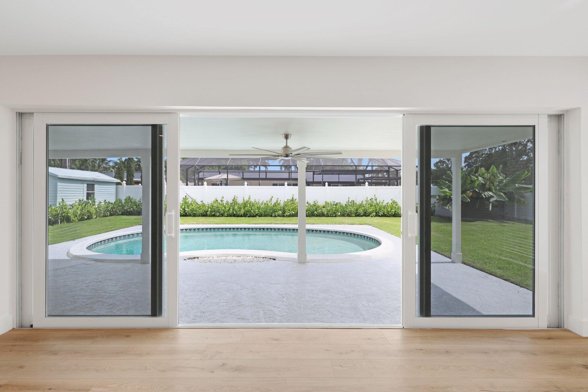 1198 Southwest 3rd Street Boca Raton, FL 33486 - Photo 4 of 29 a view of a livingroom with a floor to ceiling window and stairs